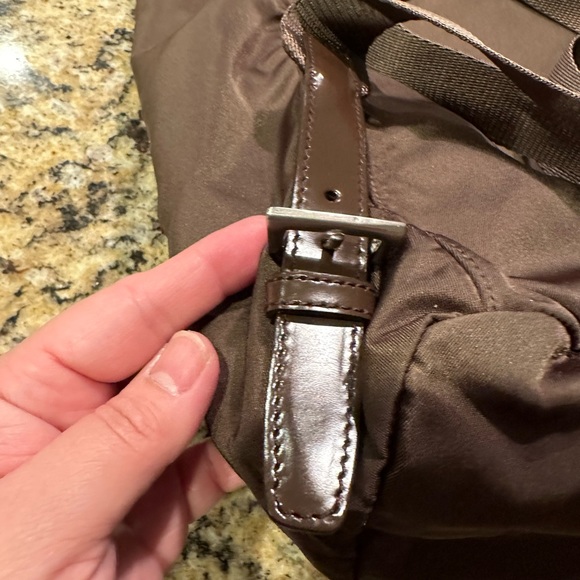 Prada backpack. Pre loved. Brown in color. Pockets inside and outside. - Picture 11 of 12